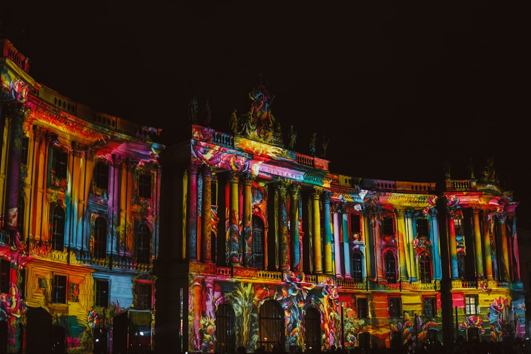 Building illuminated at night during a light event